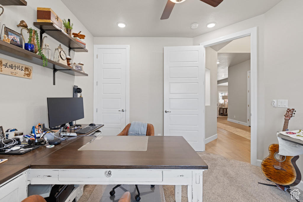 Home office with ceiling fan, light carpet, and recessed lighting