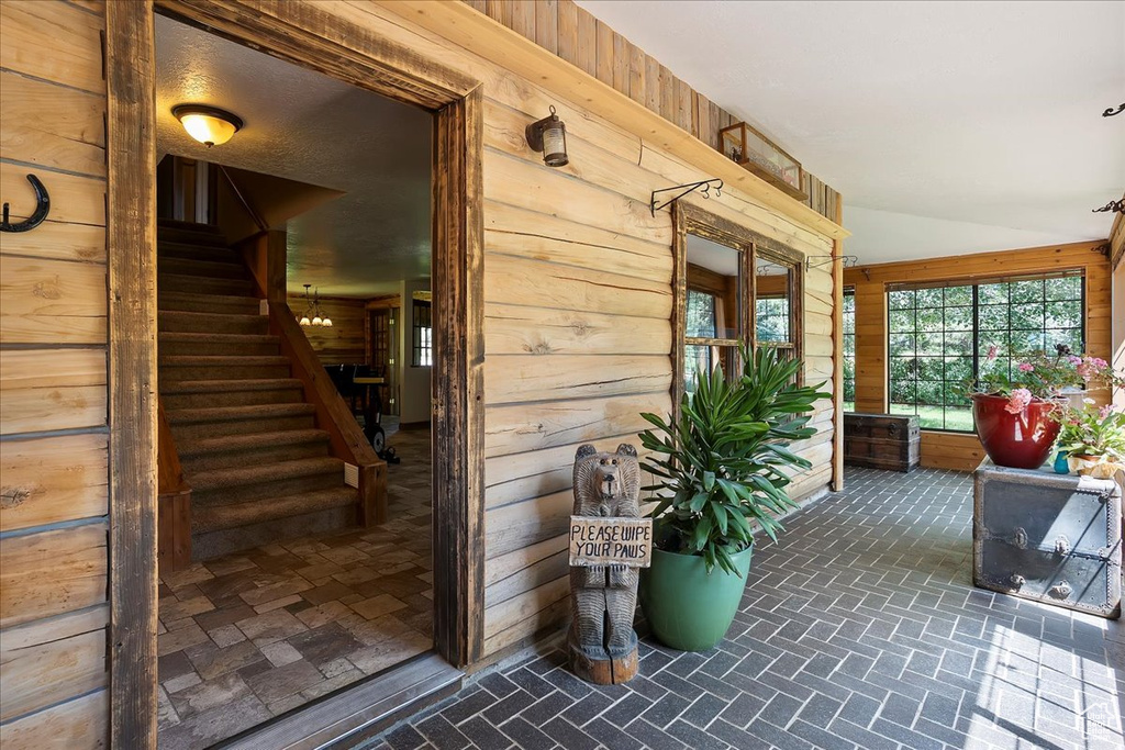 Doorway to property featuring a porch