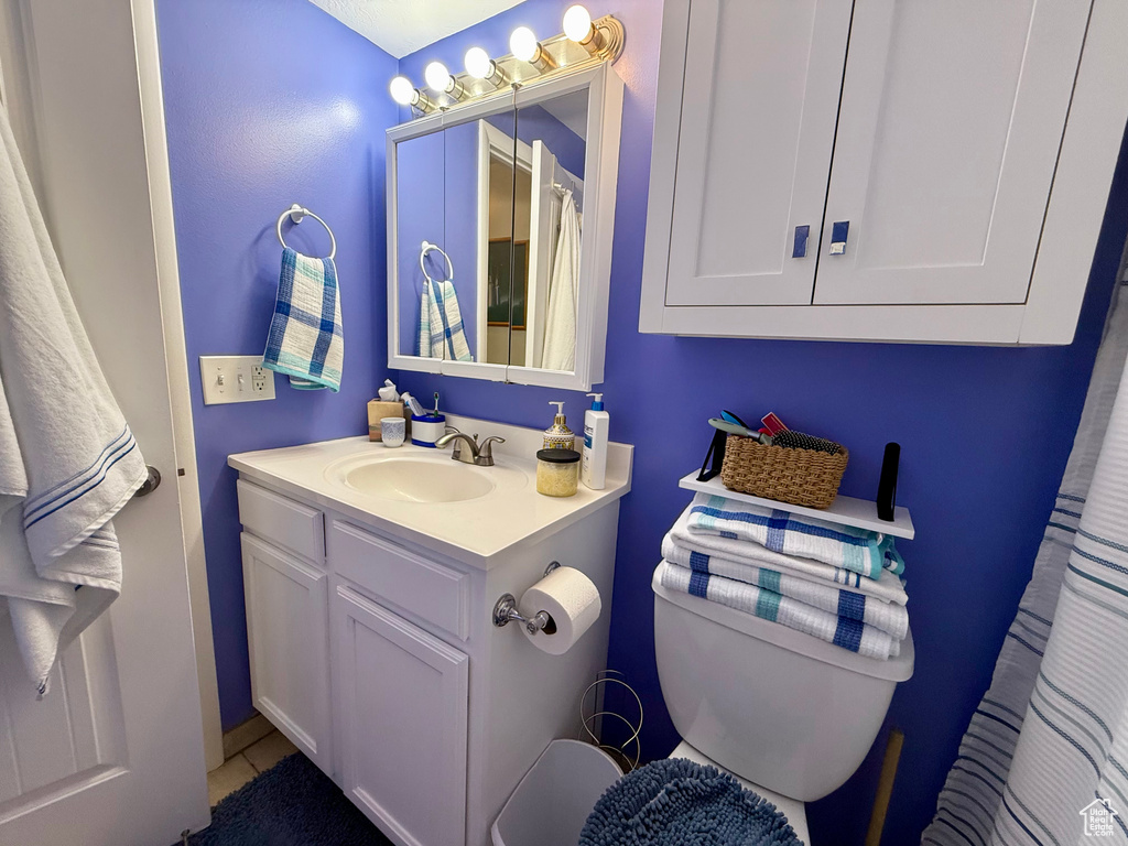 Bathroom with vanity and tile patterned flooring