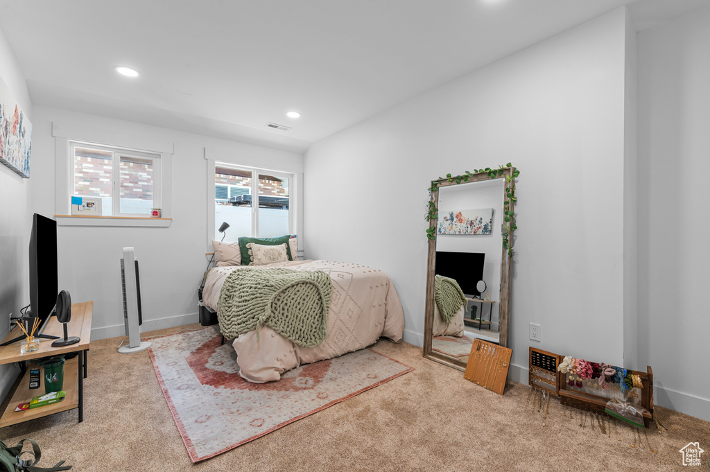 Carpeted bedroom featuring recessed lighting and baseboards