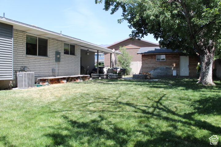 Back of house featuring a lawn