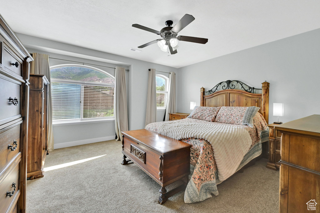 Bedroom featuring carpet flooring and a ceiling fan