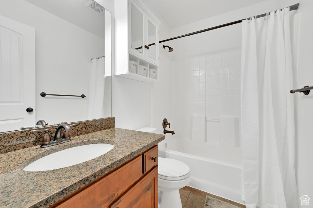 Full bathroom featuring vanity and shower / bath combo