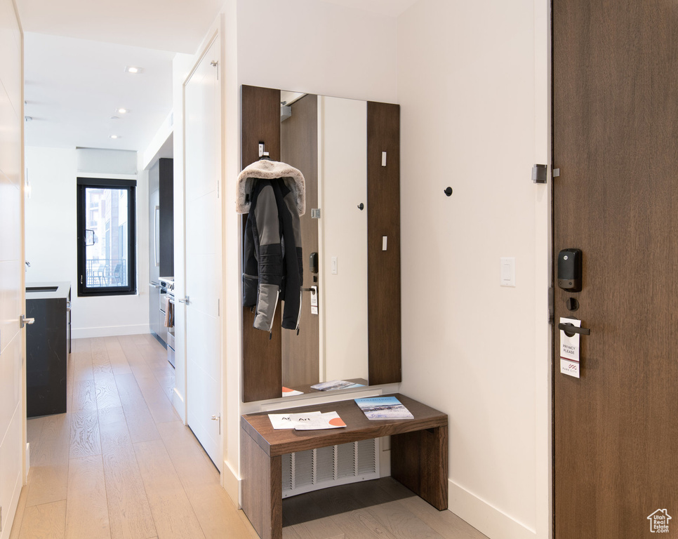 Hallway with light wood-style floors