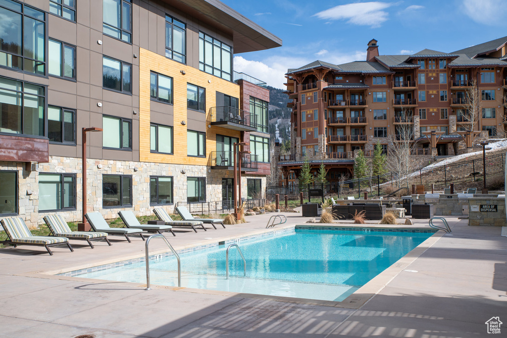 Community pool featuring a patio area