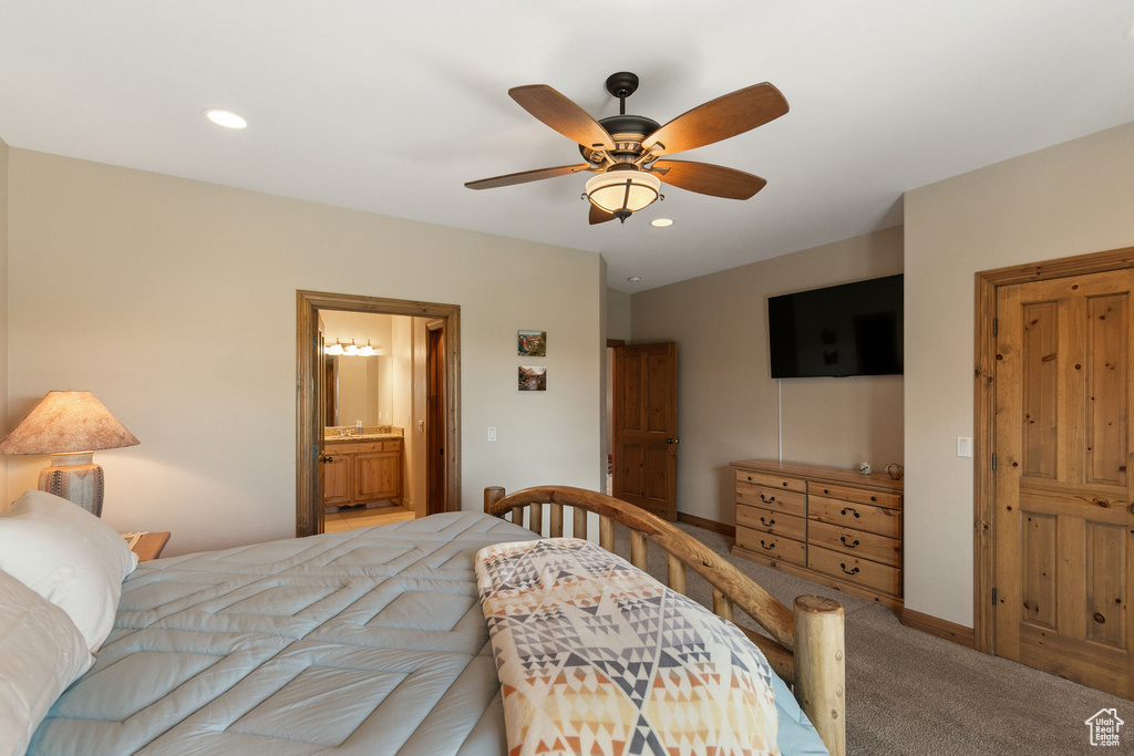 Carpeted bedroom featuring recessed lighting, ceiling fan, and connected bathroom