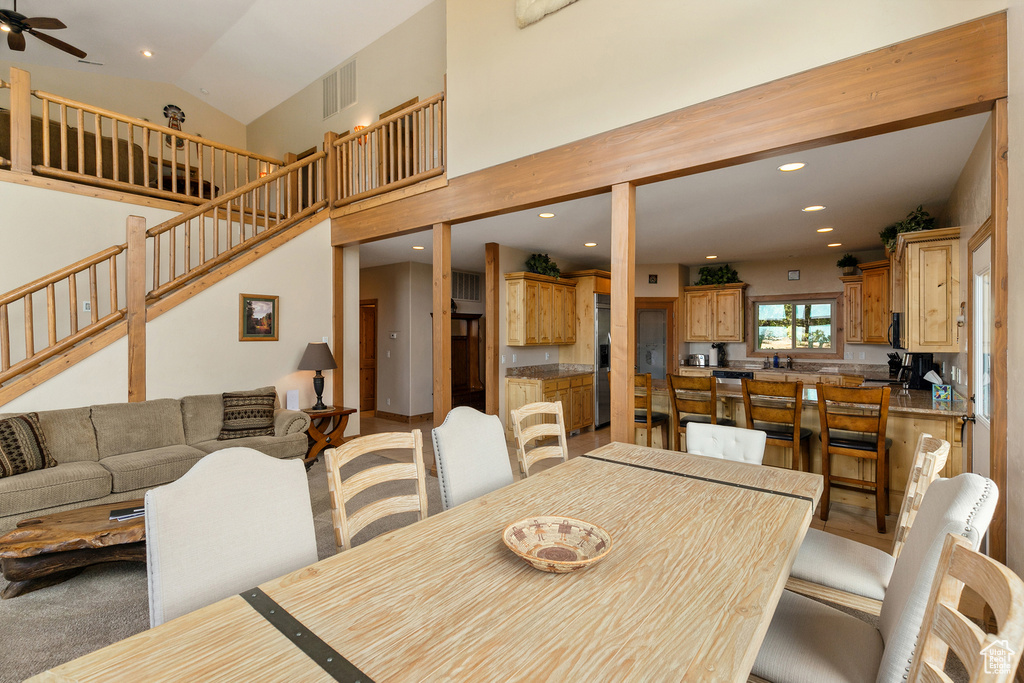 Dining area featuring recessed lighting, stairway, and ceiling fan