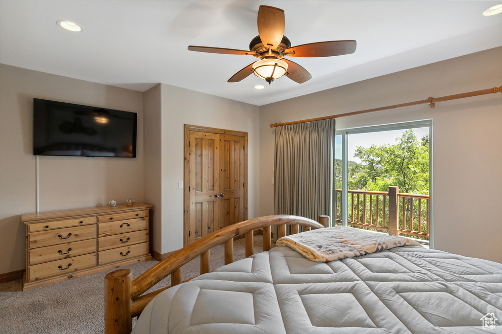 Carpeted bedroom featuring access to exterior, recessed lighting, and ceiling fan