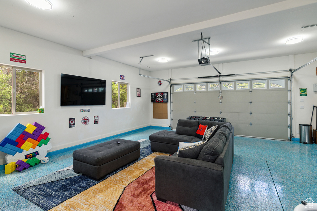 Living room with speckle patterned floor and a garage