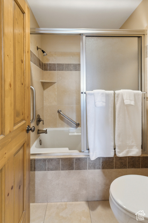 Full bath with tiled shower / bath and tile patterned flooring