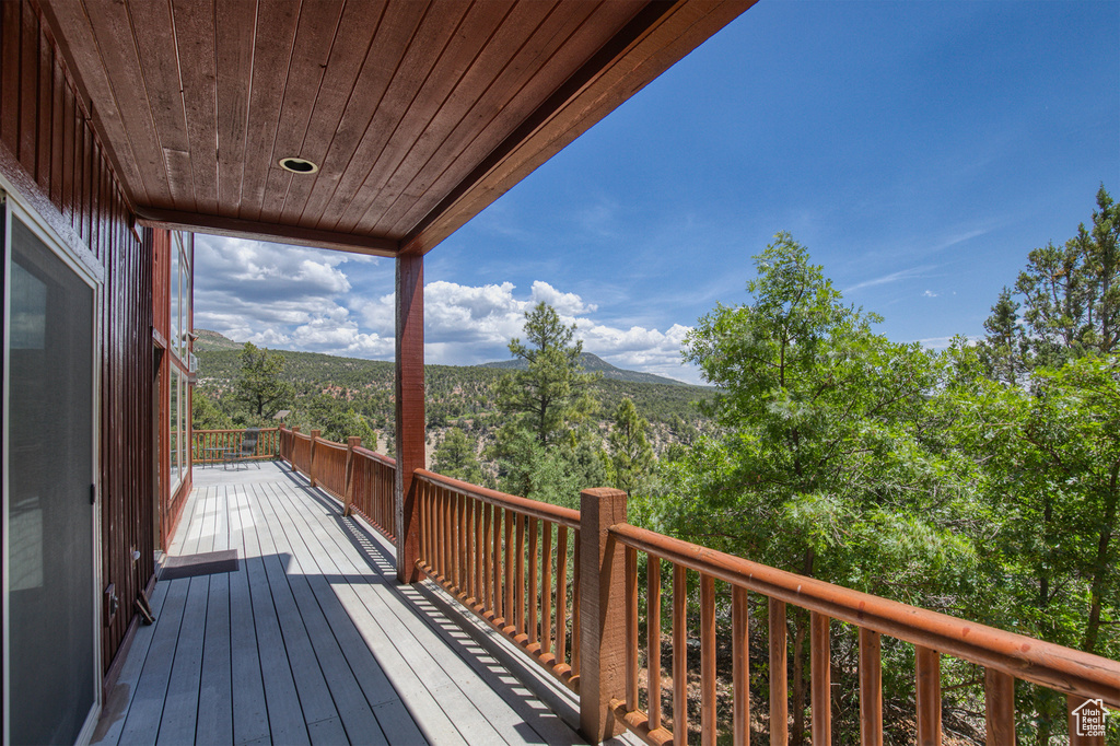 Wooden terrace featuring a mountain view