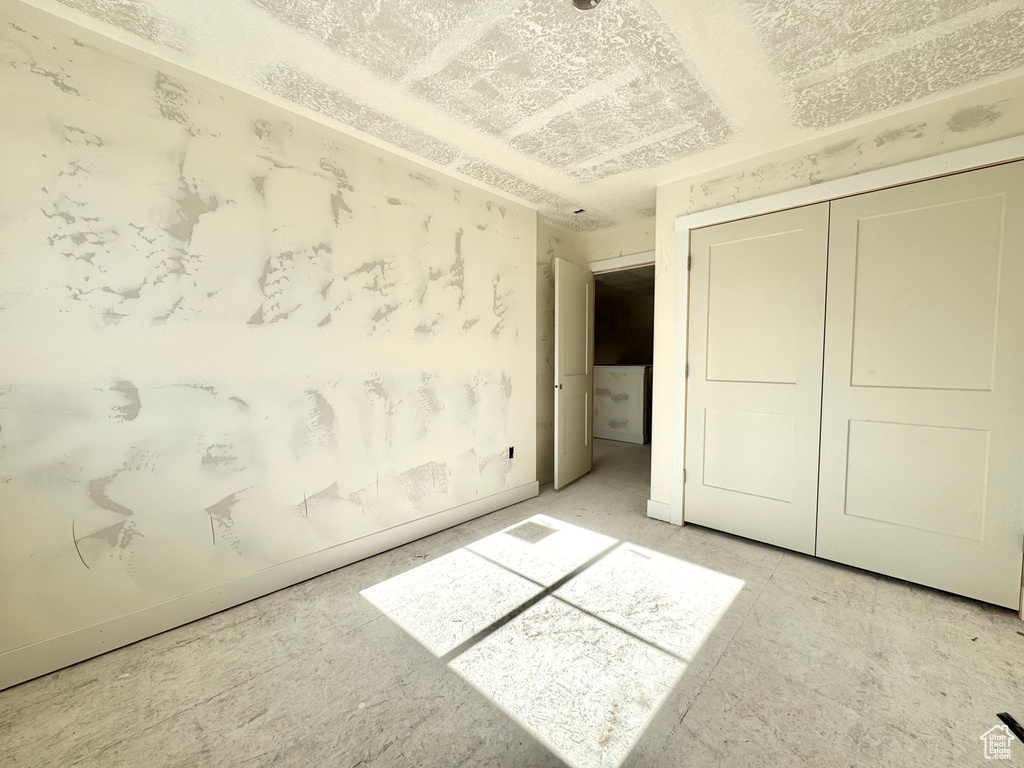 Unfurnished bedroom with a closet