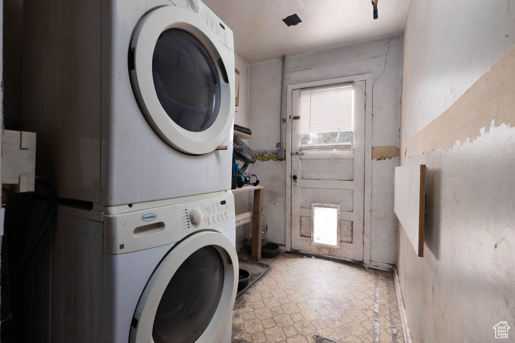 Washroom with stacked washer / drying machine