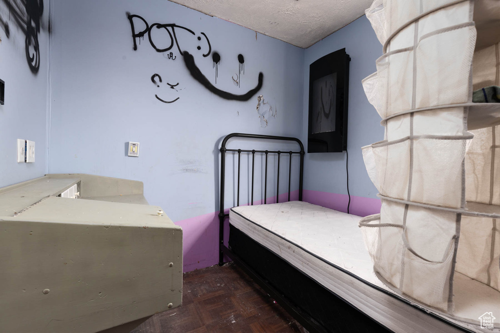 Bedroom featuring a textured ceiling