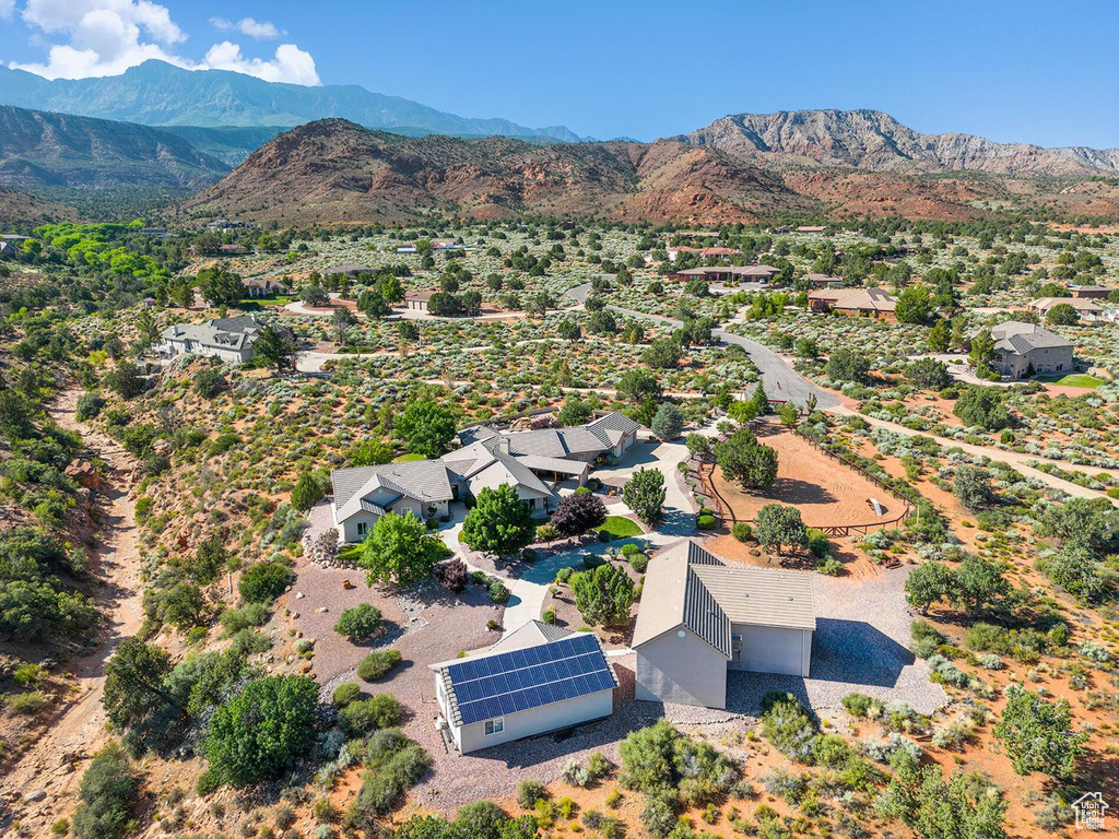 Aerial view of residential area featuring a mountainous background