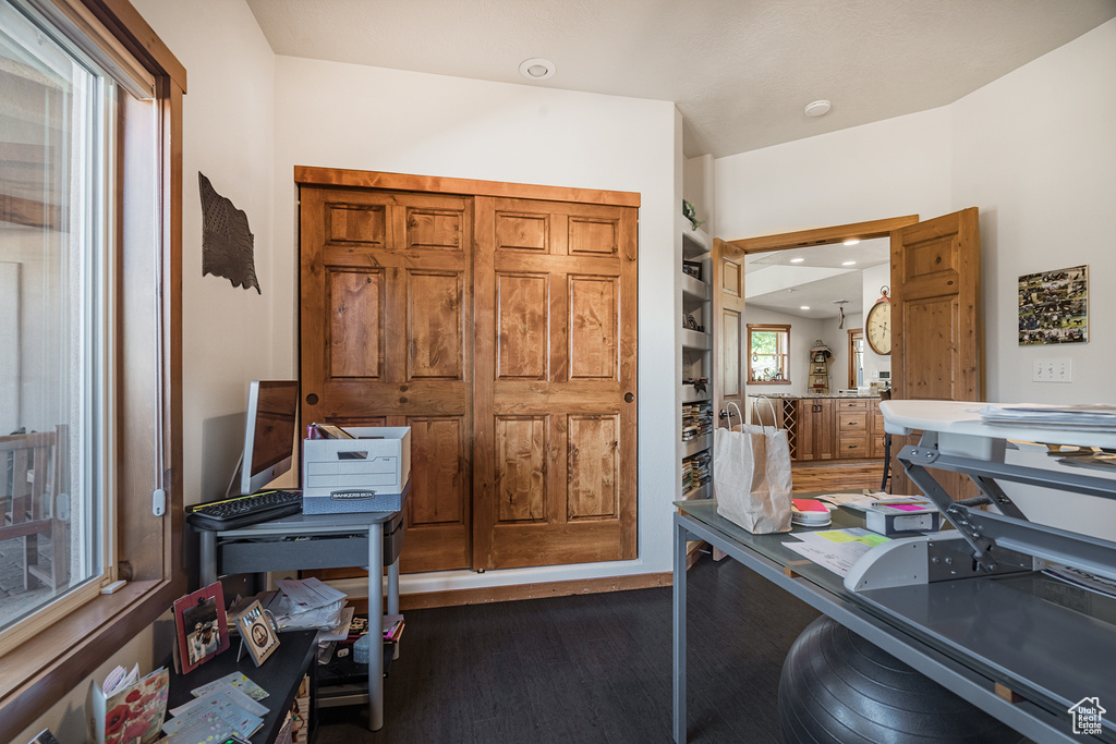 Office space with dark wood-style floors