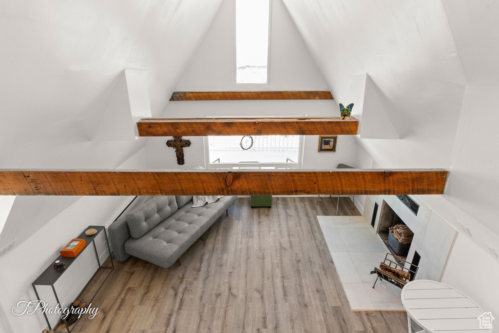 Bonus room featuring wood finished floors and lofted ceiling