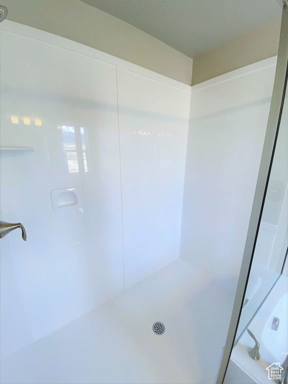 Full bath featuring a shower and a bathtub
