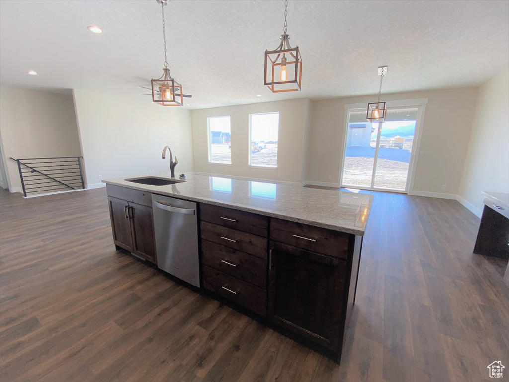 Kitchen featuring stainless steel dishwasher, dark wood finished floors, open floor plan, and recessed lighting