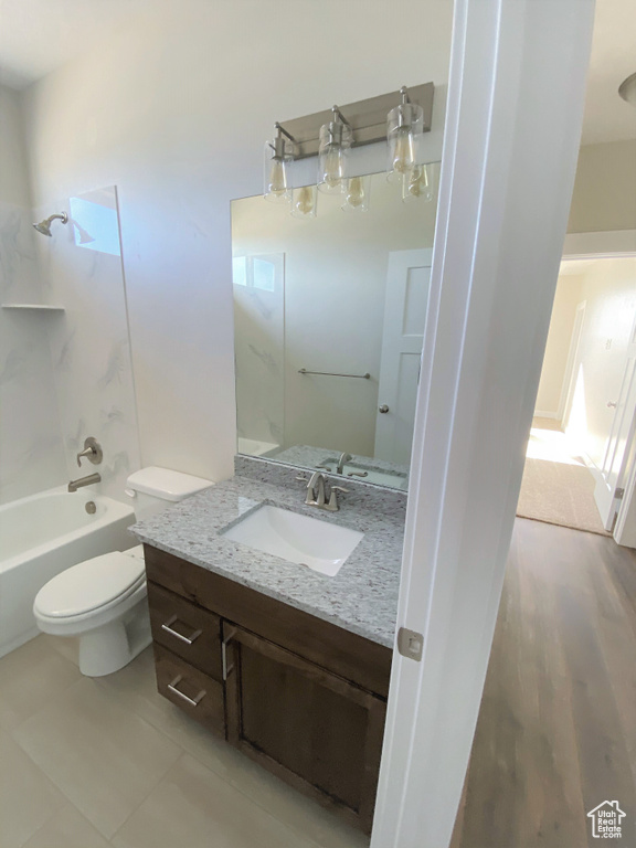 Full bath with vanity, shower / bath combination, and tile patterned floors