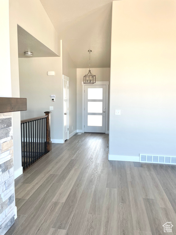 Foyer featuring wood finished floors and baseboards