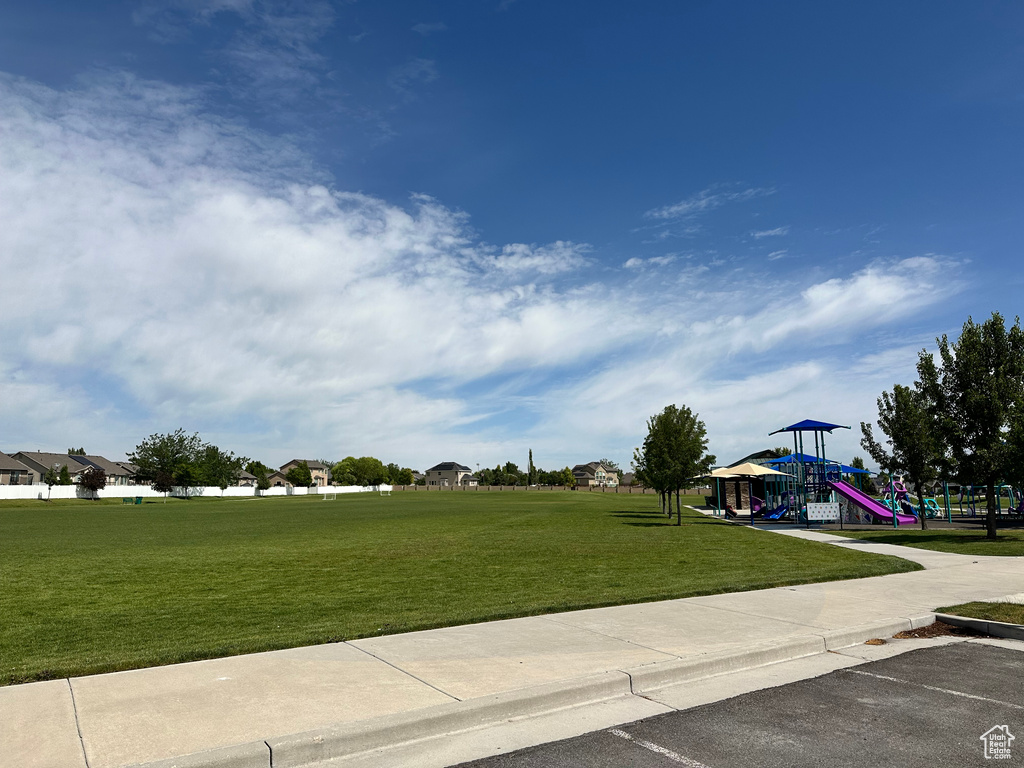 View of community featuring a yard