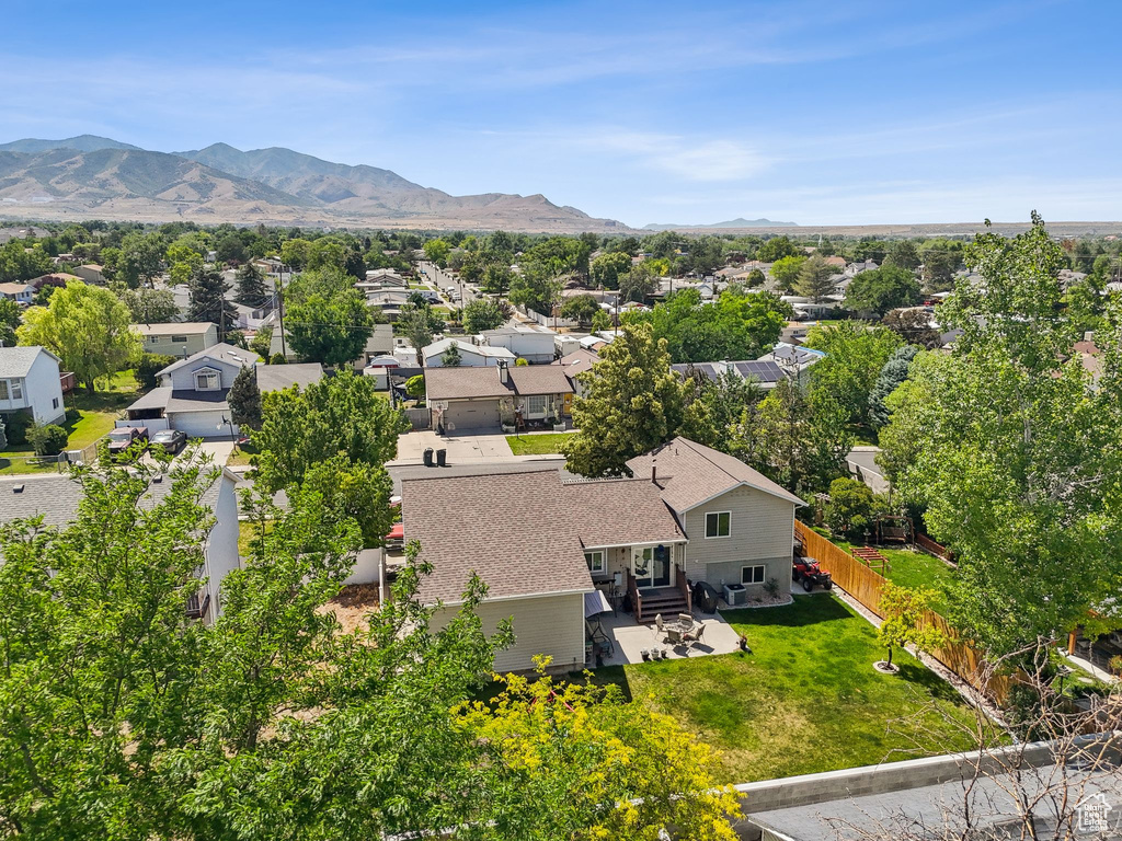 Aerial perspective of suburban area featuring a mountainous background