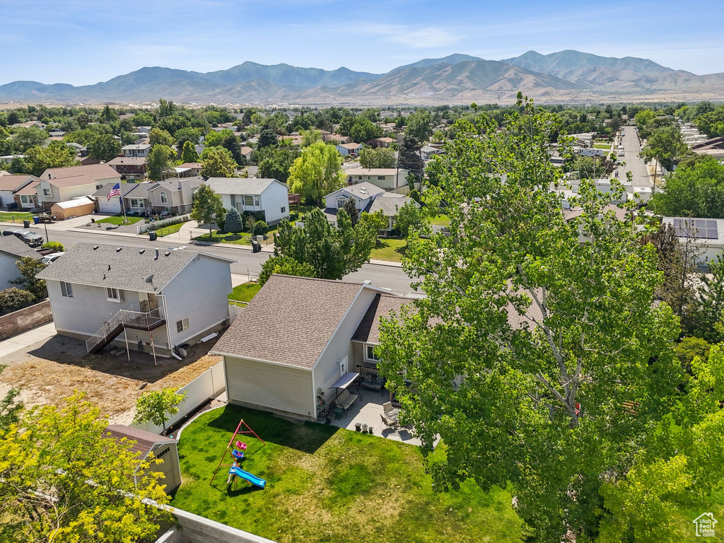 Aerial view of residential area with a mountainous background