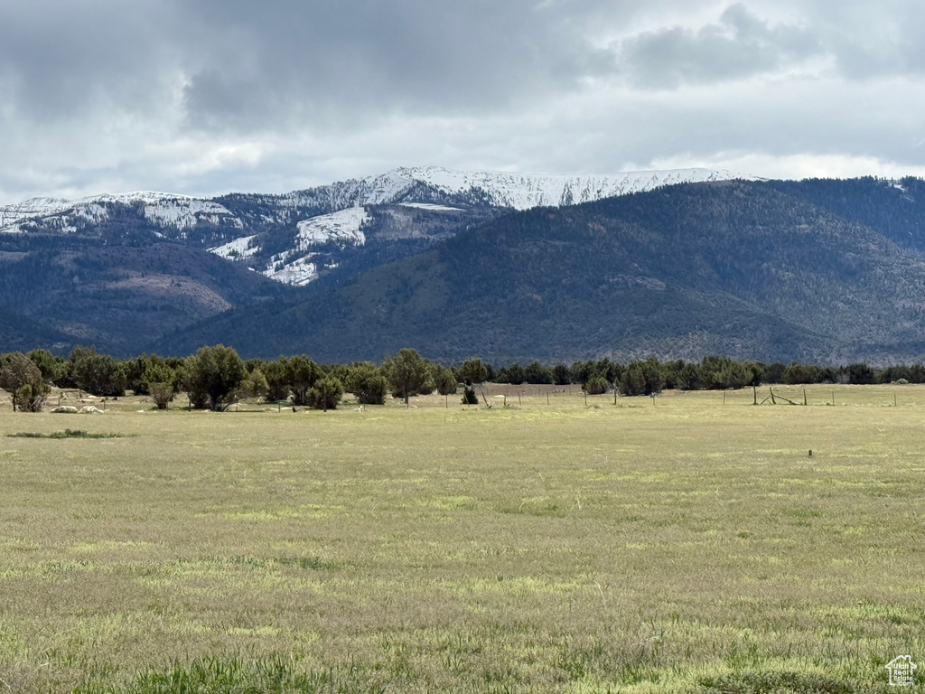 View of mountain background featuring rural landscape