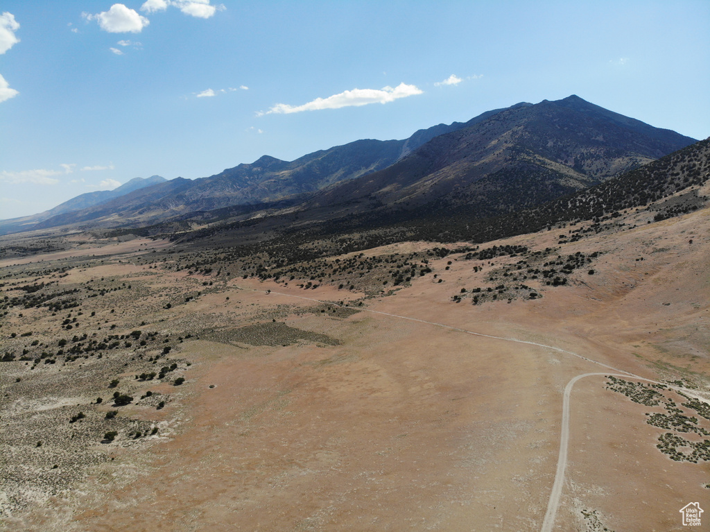View of mountain background featuring rural landscape