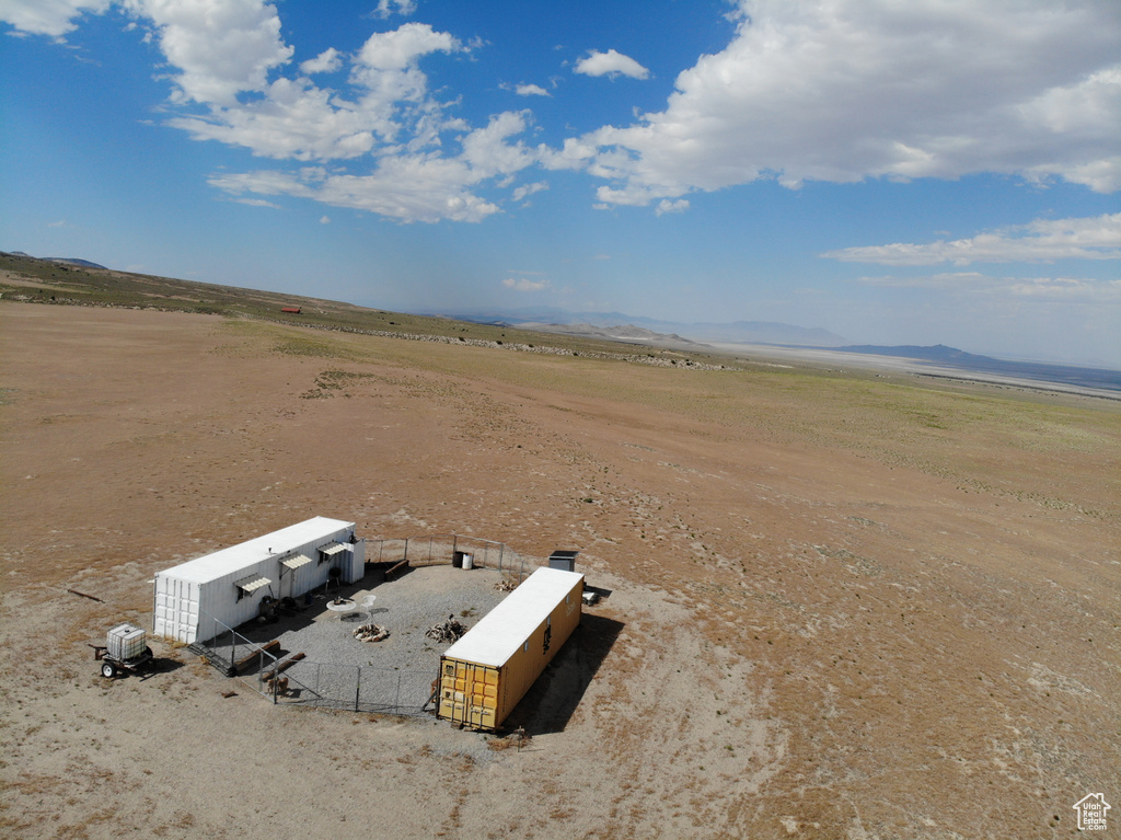 Aerial view of sparsely populated area featuring a mountain backdrop