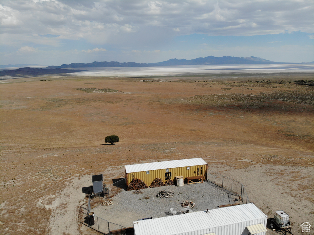 Aerial view of sparsely populated area with a mountainous background and a desert landscape