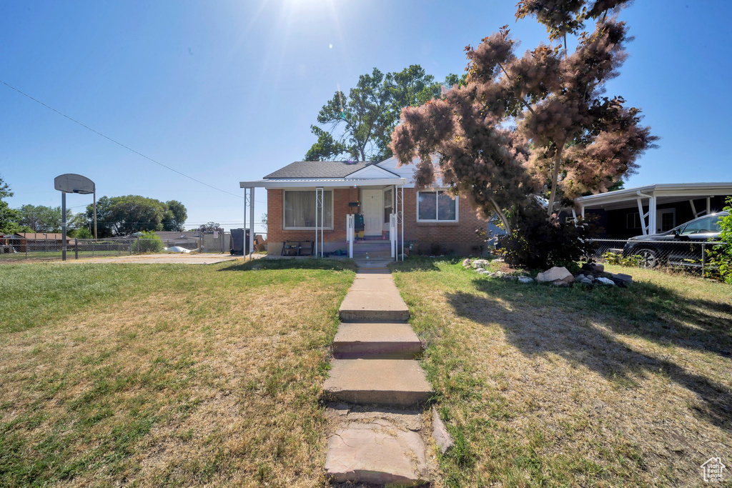 Bungalow-style home featuring brick siding