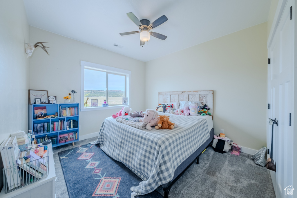 Bedroom with carpet and a ceiling fan