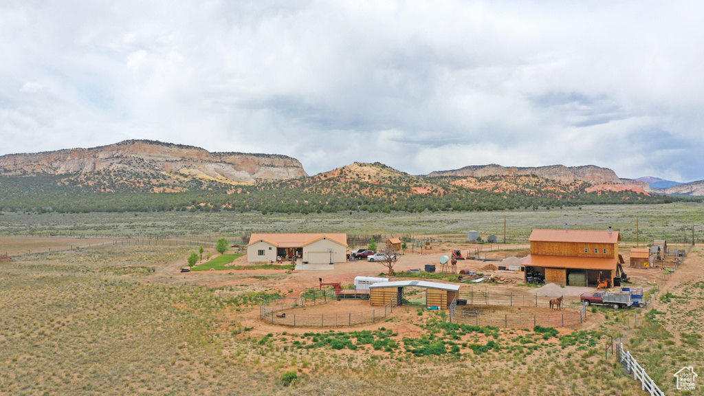 View of mountain backdrop with rural landscape