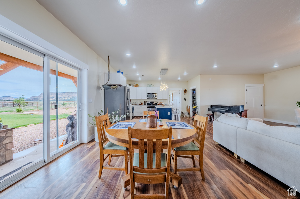 Dining area featuring recessed lighting and wood finished floors