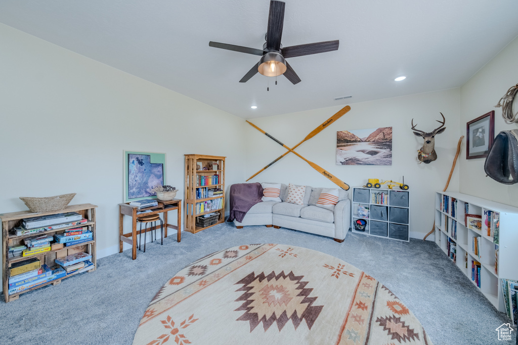 Living room featuring carpet, a ceiling fan, and recessed lighting