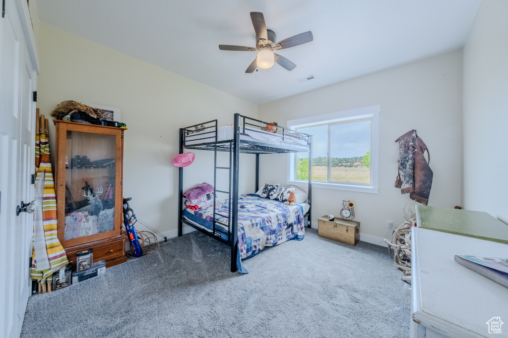 Bedroom with carpet and ceiling fan