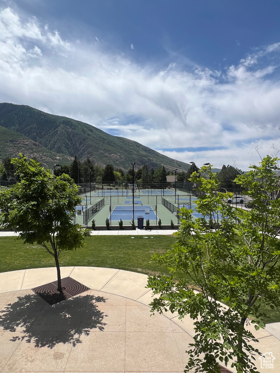 View of community with a tennis court and a mountain view