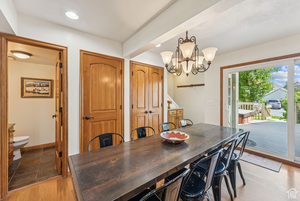 Dining area featuring a chandelier, recessed lighting, and light wood-style flooring