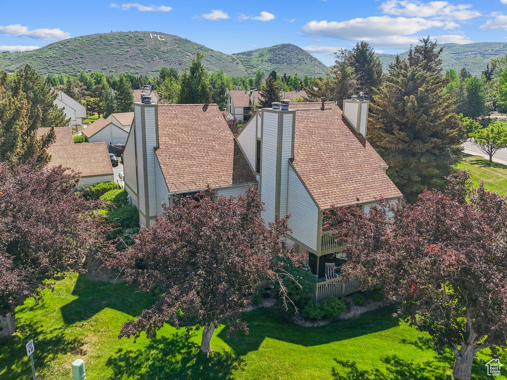 View of subject property featuring mountains