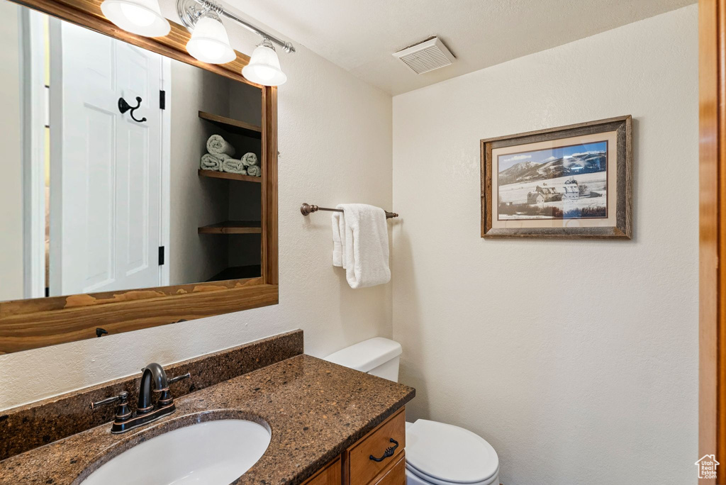 Half bath with toilet and vanity