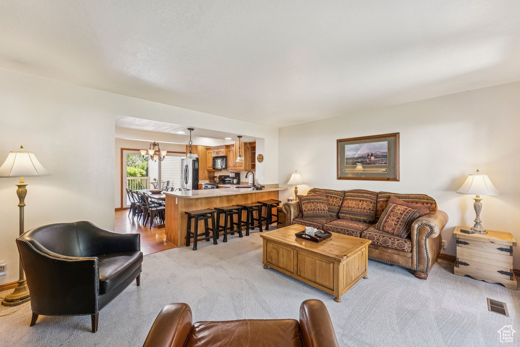 Living room featuring light colored carpet