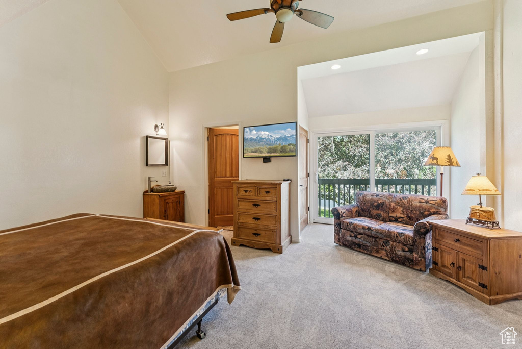 Bedroom featuring access to outside, light carpet, high vaulted ceiling, and a ceiling fan