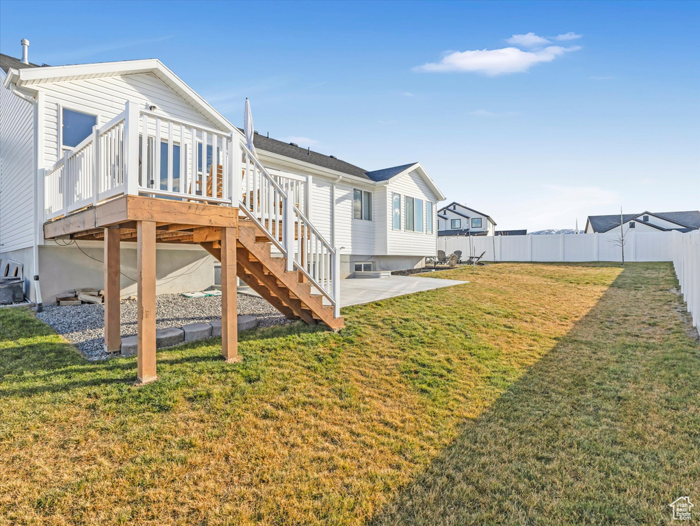 Rear view of property with a patio, a deck, and stairs