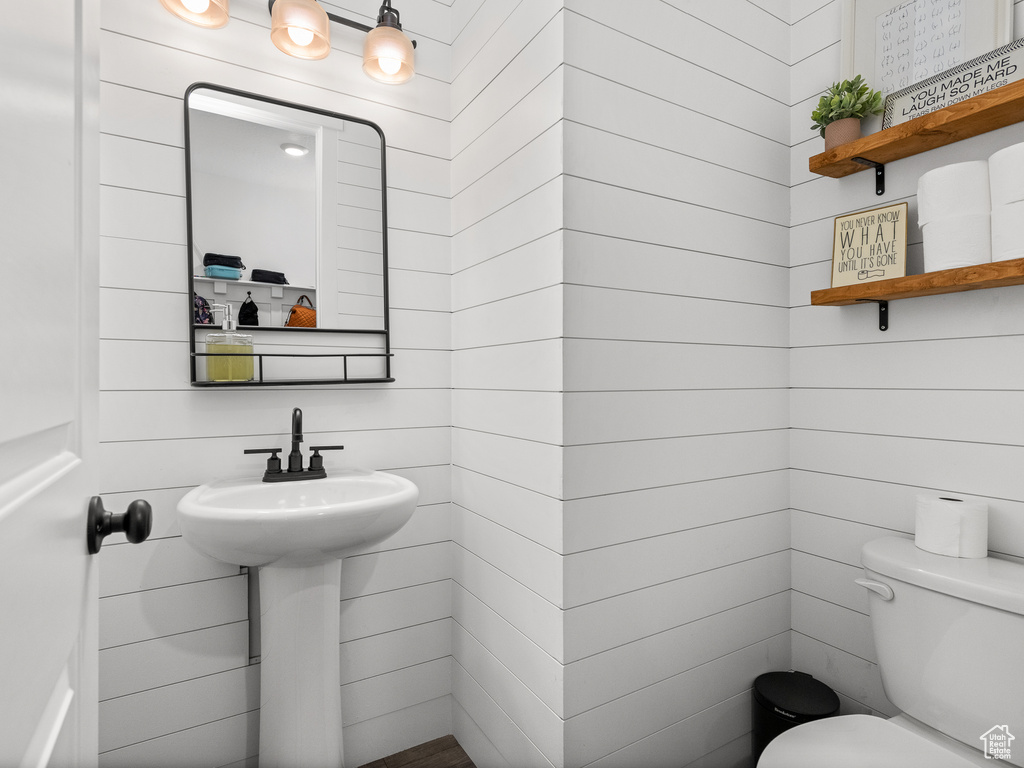 Half bath featuring toilet
