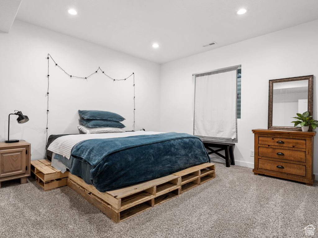 Carpeted bedroom featuring recessed lighting