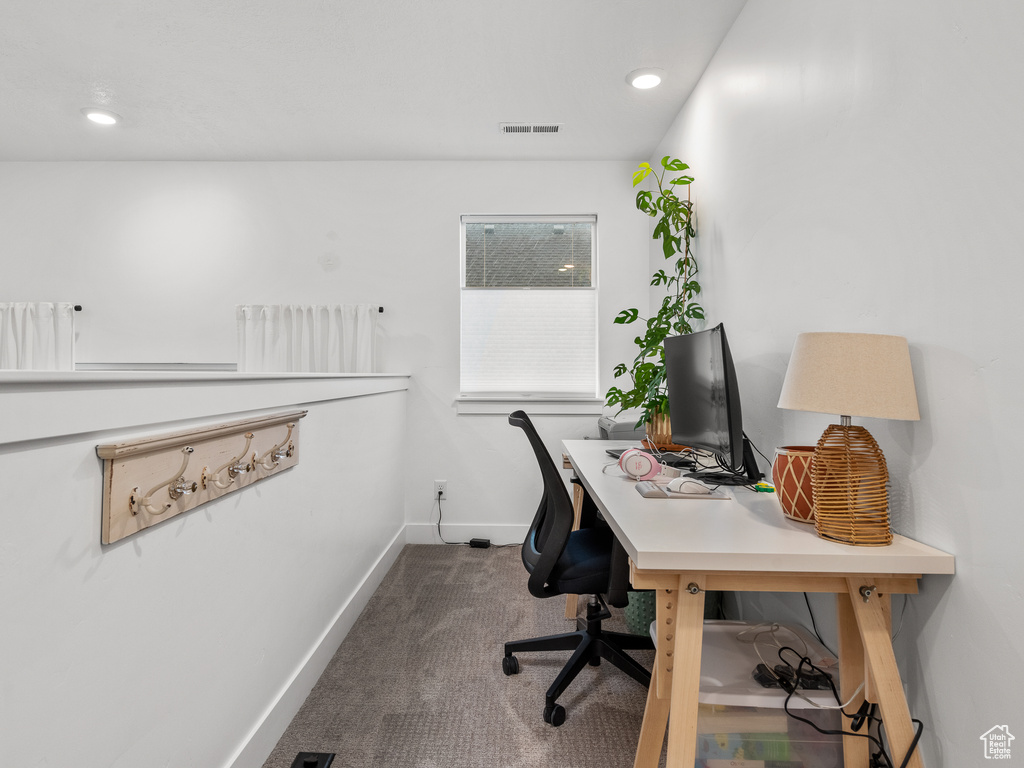 Carpeted office featuring baseboards