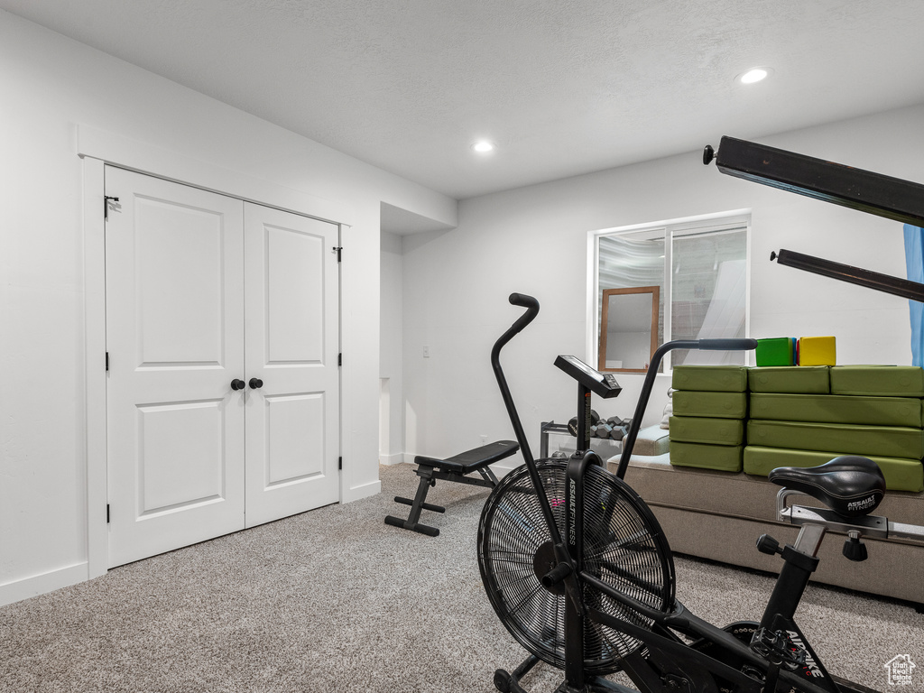 Workout room featuring recessed lighting and carpet