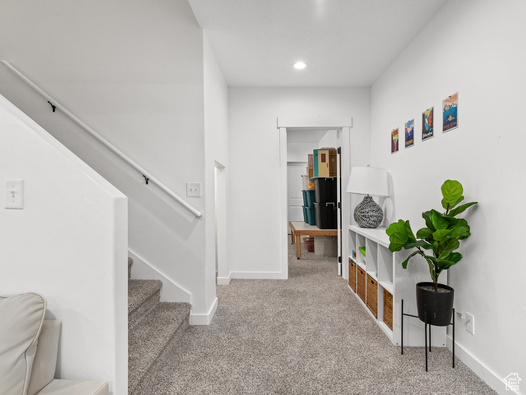 Staircase featuring carpet and recessed lighting